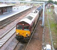 EWS 66203 held in the down loop at Carstairs station on the morning of 11 July 2006 with coal empties.<br><br>[John Furnevel 11/07/2006]