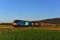 Unusual combination of the new and the old. 68024 Centaur and 37607 double head a train of autoballasters from Mossend to Dingwall. Pictured just north of Moy and an hour and forty minutes early. The class 68 was replaced by another 37 at Inverness.<br><br>[John Gray 03/06/2016]