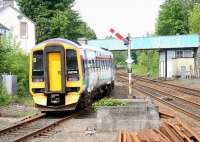 An empty terminated service from Newcraighall, formed by ScotRail 158736, moves north out of Dunblane's platform 3 on 22 June 2005. The train will use the crossover beyond the signal box to move across to the up line and run back into platform 1 before returning south as the 1126 to Edinburgh Waverley.<br><br>[John Furnevel 22/06/2005]