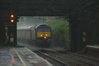 'Only mad dogs and Scotsmen go out in the mid-day rain...' (with apologies to Mr N Coward). At shortly after half past 12 an SRPS railtour from Glenrothes with Thornton to Liverpool approaches Leyland in a torrential downpour on 11 June 2016. The wipers on the WCRC Class 47 looked like they were working overtime. On returning to my car I found that it was surrounded by water in the car park!<br><br>[John McIntyre 11/06/2016]