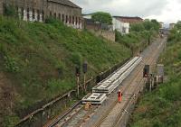 May 2016 - Slab track panels stacked on up line of Cowlairs Incline  awaiting transfer into the tunnel.<br><br>[Martin MacGuire 18/05/2016]