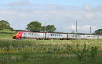 Sporting promotional vinyls for <I>Festival No.6</I> at Portmeirion, Voyager 221106 speeds south through the loops at Oubeck with a Euston (via Birmingham) service on 23rd May 2016. <br><br>[Mark Bartlett 23/05/2016]