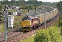 EWS 37405 passes Blindwells with the Oxwellmains - Powderhall empty 'bins' in June 2006.<br><br>[Bill Roberton /06/2006]