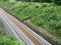 New rail awaiting transfer and laying on new slab panels for down line in Queen St tunnel. Note headless post for signal CO24B.<br><br>[Martin MacGuire 15/06/2016]