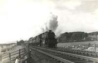 Corkerhill Black 5 45460 accelerates as it heads south from Largs with a summer Saturday train for Law Junction on 1st July 1961. The young observer standing alongside the fence looks suitably impressed.<br><br>[G H Robin collection by courtesy of the Mitchell Library, Glasgow 01/07/1961]