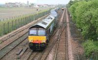 DRS 66401 is about to move a container train through Fouldubs Junction and past the W H Malcolm Grangemouth depot on 30 July 2008 before heading for Aberdeen. Meantime, a classmate is standing at signals in the background awaiting the road into the depot.<br><br>[John Furnevel 30/07/2009]