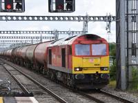 60039 west bound with the Theale to Robeston oil tanks.<br><br>[Peter Todd 16/06/2016]