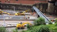 Signalling cables being installed at the new gantry at Queen Street. Hard to see because of their black finish, new signals have been mounted underneath the gantry.<br><br>[Colin McDonald 22/06/2016]
