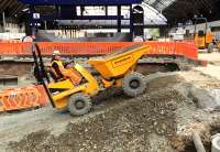  The ramp giving access to the area being excavated for the south platform extensions at Glasgow Queen Street makes the gradient of the Cowlairs incline look insignificant in comparison, but the passenger carrying capacity of the dumper truck seen here is somewhat more limited than that of the new trains. <br><br>[Colin McDonald 22/06/2016]