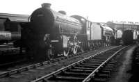 K1 2-6-0 62021 stands in bright sunshine in the sidings at the west end of Heaton shed on Saturday 11 April 1964. 62021 is a visitor from Tweedmouth and carries a 52D shed plate.<br><br>[K A Gray 11/04/1964]