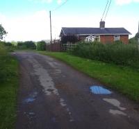 Looking north beyond the small settlement of Broughton, east of Malton, towards the former level crossing over Moor Lane, with the crossing keepers dwelling, now named Gate House, sited on the north side of the line. I was advised that the crossing keeper at closure still lives in the property. <br><br>[David Pesterfield 20/06/2016]