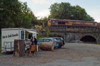 Despite appearances, this Hunterston-Longannet coal train is not halted on Alloa viaduct while the driver sneaks a bacon butty at the “Farm Snack Bar”. The railway “passing trade” ended with the closure of Longannet power station in March 2016, six months after this photo was taken. At the time of writing, the drive in snack bar (highly recommended) was still going strong.<br><br>[Mark Dufton 19/09/2015]