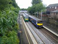 320s in a choice of liveries at Cambuslang on 25/06/2016.<br><br>[David Panton 25/06/2016]