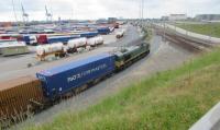 Class 66 at Zeebrugge coming out of the Albert II Dok container sidings to join the southbound lines. These locomotives are owned by Ascendos Rail Leasing and operated by Railtraxx.<br><br>[John Yellowlees 22/06/2016]