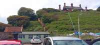 The former Sandsend station viewed from below looking south west. The viaduct which existed to the left has been demolished.<br><br>[Rod Crawford 02/07/2016]