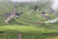 BRB No.16, zig-zagging up the Rothorn mountainside on the section above Planalp loop, as seen from a following train in June 2016. The low speeds of these rack trains means that two travelling in the same direction are allowed to occupy the same section of track.<br><br>[Mark Bartlett 20/06/2016]