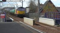 Colas Railfreight class 60 no. 60026 approaches Prestwick, after run round in Ayr station, with loaded aviation fuel tanks bound for BP Prestwick air terminal.<br><br>[Ken Browne 26/04/2016]