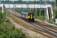 With the Euxton Jct to Lostock Jct line closed for engineering work, Blackpool North to Manchester Victoria services are diverted via Wigan on weekends at the moment. Here such a service is seen crossing from the Up Slow line at Balshaw Lane Jct on a sunny afternoon on 03 July 2016.<br><br>[John McIntyre 03/07/2016]