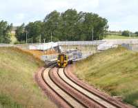 The 0925 Sunday service to Tweedbank (0911 ex-Waverley) leaves Shawfair station on 3 July 2016 during a sunny spell between showers of rain.<br><br>[John Furnevel 03/07/2016]