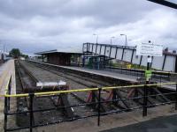 Rock Ferry station on 29/06/2016, with the little-used bay platforms in the foreground.<br><br>[David Panton 29/06/2016]