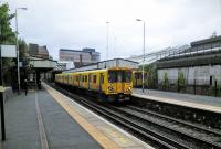 A Chester service calls at Birkenhead Central on 29/06/2016.<br><br>[David Panton 29/06/2016]