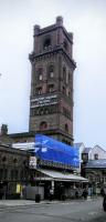 The landmark tower at Hamilton Square station in Birkenhead still boasts its British Railways era lettering together with a ghost of something even older. A bank of four spacious lifts take you down to the platforms; shades of the London Underground.<br><br>[David Panton 29/06/2016]