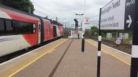 Virgin East Coast HST waiting to proceed across the Royal Border Bridge from Berwick upon Tweed on an overcast but dry Saturday. The sign on the platform still claims that this is the station for the Borders despite there now being a train service to the Central Borders.<br><br>[Charlie Niven 18/06/2016]