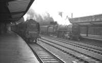 Southbound services stand together at Carlisle station in late 1960. On the left is Stanier Pacific 46234 <I>Duchess of Abercorn</I>, about to head south on the WCML. On the right is Britannia Pacific 70044 <I>Earl Haig</I>, preparing to take the Midland route with the up <I>Thames-Clyde Express</I>.<br><br>[K A Gray //1960]