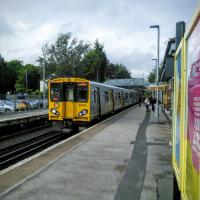 A Liverpool-bound service rolls into Town Green on the Ormskirk line on 29/06/2016.<br><br>[David Panton 29/06/2016]