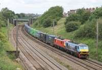 DB 90024, sporting bright new <I>Malcolm</I> vinyls, pilots DB red liveried 90019 through Farington Curve Junction with a Coatbridge to Daventry container service on 12th July 2016. <br><br>[Mark Bartlett 12/07/2016]