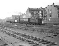 A train from Hyndland terminus comes off the short branch at Partick Junction on 24 May 1957 with a service to Airdrie. The locomotive is class N2 0-6-2T 69563. [Ref query 39422] <br><br>[G H Robin collection by courtesy of the Mitchell Library, Glasgow 24/05/1957]