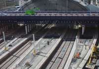 It has been so long since trains have called at Queen Street High Level that a giant spider has started to spin a web across platforms 2,3,4 and 5. Actually, Incy Wincy is spinning a yarn there – headspans are beginning to appear at the north end of the rebuilt platforms.<br><br>[Colin McDonald 21/07/2016]