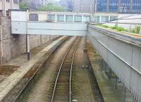 A view from  the footbridge showing the middle road between (former) Platforms 8 and 9 looking north. Note the digital display screen on a post to the right of the track. This is an indicator which shows the speed of rail vehicles as they pass through the carriage washer which is situated some distance to the south of the station.<br><br>[Charlie Niven 20/06/2016]