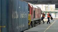 Change at Carlisle as crews swap on DB Cargo 66114 working 4M30 Grangemouth to Daventry intermodal.<br><br>[Ken Browne 09/04/2016]