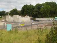 The abutments for the replacement of Haigh Lane arched overbridge are now fully complete, plus casting of the bridge deck has also been completed, as seen in this view of 13 July. The bridge is to be fully assembled before being transported the short distance into new position astride a multi-wheeled heavy lift vehicle during a 52 hour possession over the first weekend in August. <br><br>[David Pesterfield 13/07/2016]