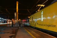 A Network Rail test train stops at Preston just before midnight  on 15 July 2016 whilst working from Blackpool to Derby, although not the direct route. The train had run earlier run via Preston, Blackburn, Hellifield, Carnforth, Morecambe (reverse), then back tracking to Blackburn where it travelled to Bolton(reverse) back to Blackburn (reverse) and then Preston (reverse). It finally headed south towards Derby with the overhead line inspection coach having the pantograph raised. What was noticeable was the foliage stuck in the pantograph which it appears to have collected earlier in the journey. The loco on the front for the next part of the journey was Inter City liveried 37254 and Colas liveried 37175 was on the rear.<br><br>[John McIntyre 15/07/2016]