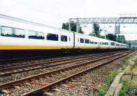 NoL Eurostar (now known as TGV Eurostar) on a test run on the WCML. At 14 coaches long it was not possible to capture the whole train from the trackside where the photographer was working. [see image 55905] for the power car and the leading coaches.<br><br>[Charlie Niven /07/1998]