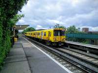 A New Brighton service calls at Wallasey Village on 30/06/2016.<br><br>[David Panton 30/06/2016]