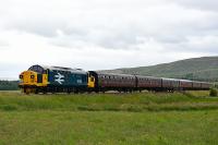 37025 Inverness TMD was based at Inverness for many years and was a<br>
regular performer on The Far North Line, The Kyle Line and The Highland<br>
Main Line. After acquisition and restoration to main line standard by<br>
the Scottish Thirty-Seven Group, 37025 is pictured nearing Inverness<br>
with an SRPS Railtour from Linlithgow.<br><br>[John Gray 16/07/2016]