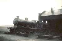 Ex-Caledonian 4-4-0 no 54440 stands on Balornock Shed in pouring rain on 27 May 1950.<br><br>[G H Robin collection by courtesy of the Mitchell Library, Glasgow 27/05/1950]