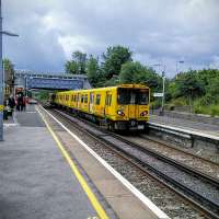 A New Brighton service calls at Wallasey Grove Road on 30/06/2016. The sharp-eyed will spot the platforms of Wallasey Village in the background. I was easily able to walk to it, write this caption then photograph the next 15 minute service!<br><br>[David Panton 30/06/2016]