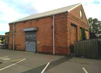 Not so much an old goods shed, more a time warp. To the right, the 19th century: a storage space for safety bicycles. Out of sight to the left, the 21st century: two charging points for electric vehicles. [Ref query 30892]<br><br>[Ken Strachan 16/07/2016]