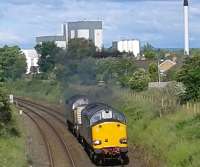 Two class 37's passing Dalston Cumbria on route to Sellafield on 21/06/2016. In the background is the Dalston Nestle plant.<br>
<br><br>[Brian Smith 21/06/2016]