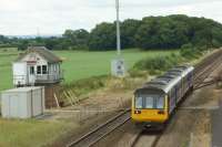 A pair of Class 142s head west towards Blackpool and pass Salwick No.2 signalbox on 30 July 2016. It would appear from the steelwork that the box is in need of some support so that it can continue to signal trains for a little while longer. Under the electrification work on the line to Blackpool North, Salwick No.2 will close. At the moment it works to Preston PSB in the east and Kirkham in the west.<br><br>[John McIntyre 30/07/2016]