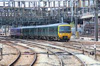 Class 166 DMU's approaching Paddington with the lead set in the new GWR colours.<br><br>[Alastair McLellan 15/05/2016]