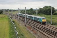 An ATW Holyhead to Manchester service, led by DVT 82308 and propelled by silver 67012, approaches Winwick Junction on 4th July 2016. Here the train will take the line to Earlestown to join the Liverpool and Manchester line.<br><br>[Mark Bartlett 04/07/2016]