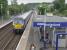 Looking north at Anniesland as 334034/008 approach.  At the rear of the train is the bay platform and Knightswood South Junction.<br><br>[Bill Roberton 18/07/2016]