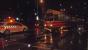 A cyclist pauses alongside the aftermath of a collision between a tram and a car in torrential rain one November evening in Den Haag. You can see the tram's skirt is hanging off. I was on that tram - and was none too pleased to have to get off!<br><br>[Beth Crawford 17/11/2015]