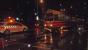 A cyclist pauses alongside the aftermath of a collision between a tram and a car in torrential rain one November evening in Den Haag. You can see the tram's skirt is hanging off. I was on that tram - and was none too pleased to have to get off!<br><br>[Beth Crawford 17/11/2015]