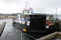 MV <I>Maid of Glencoul</I>, with its distinctive corner loading ramps, at Rothesay Pier on 25th July 2016. It was previously used on the Corran Ferry across Loch Linnhe but is just now the <I>Reserve</I> for <I>MV Corran</I>, which operates that crossing [See image 55993], and berthed some distance away should it be required.<br><br>[Mark Bartlett 25/07/2016]